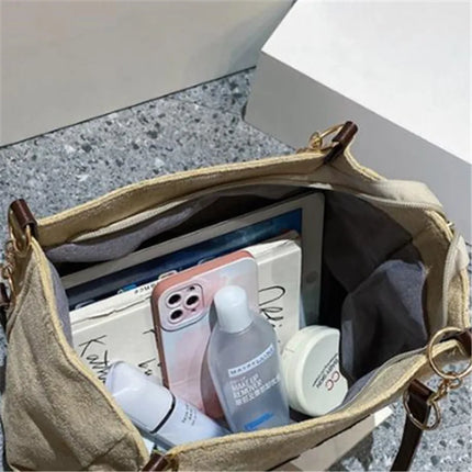 حقيبة يد متوسطة بمقابض علوية وحزام كتف