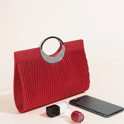 حقيبة كف مزخرفة بمقبض علوي