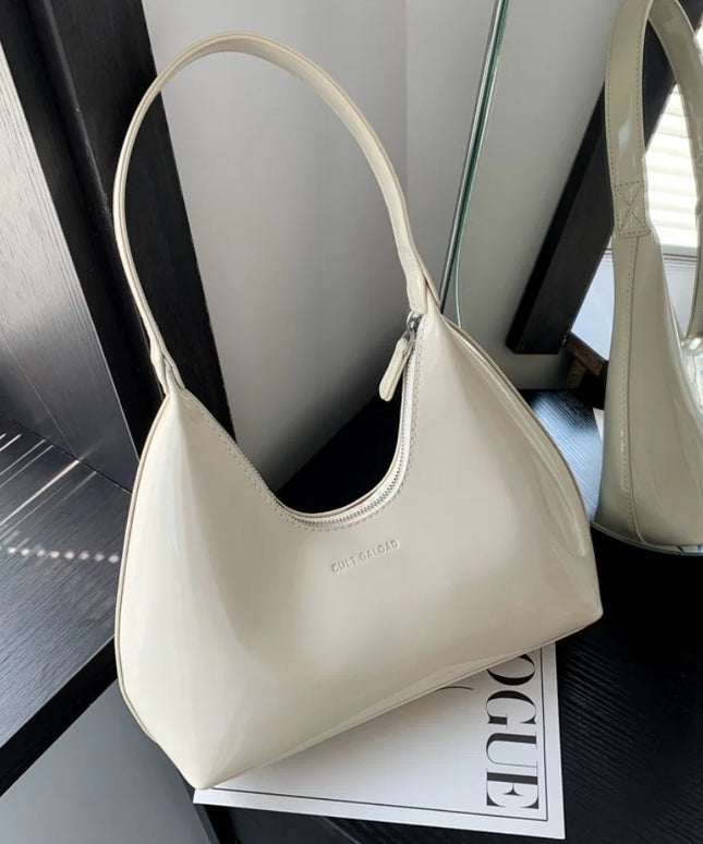 حقيبة كتف عصرية بجلد لامع بتصميم هلالي