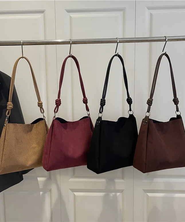 حقيبة يد كبيرة بتصميم مفتوح ومقبض واحد