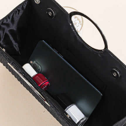 حقيبة كف مزخرفة بمقبض علوي