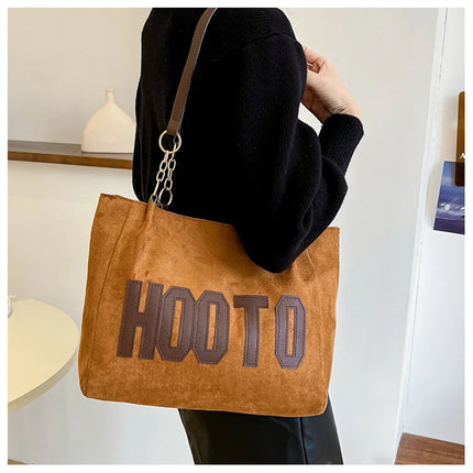 حقيبة يد متوسطة بمقابض علوية وحزام كتف