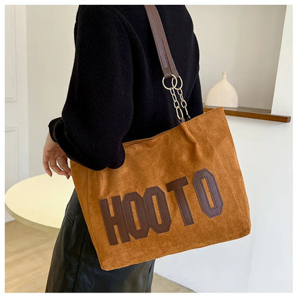 حقيبة يد متوسطة بمقابض علوية وحزام كتف