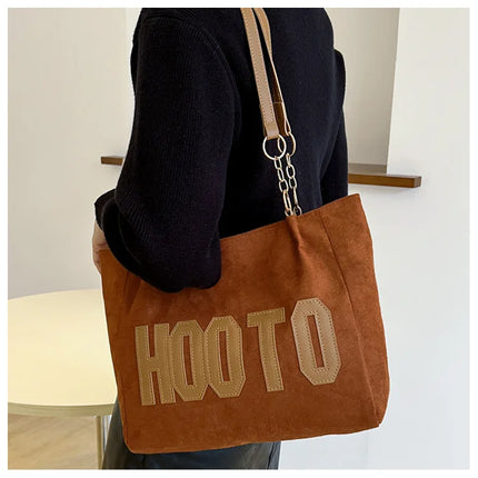 حقيبة يد متوسطة بمقابض علوية وحزام كتف