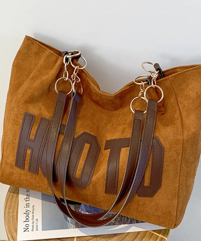 حقيبة يد متوسطة بمقابض علوية وحزام كتف